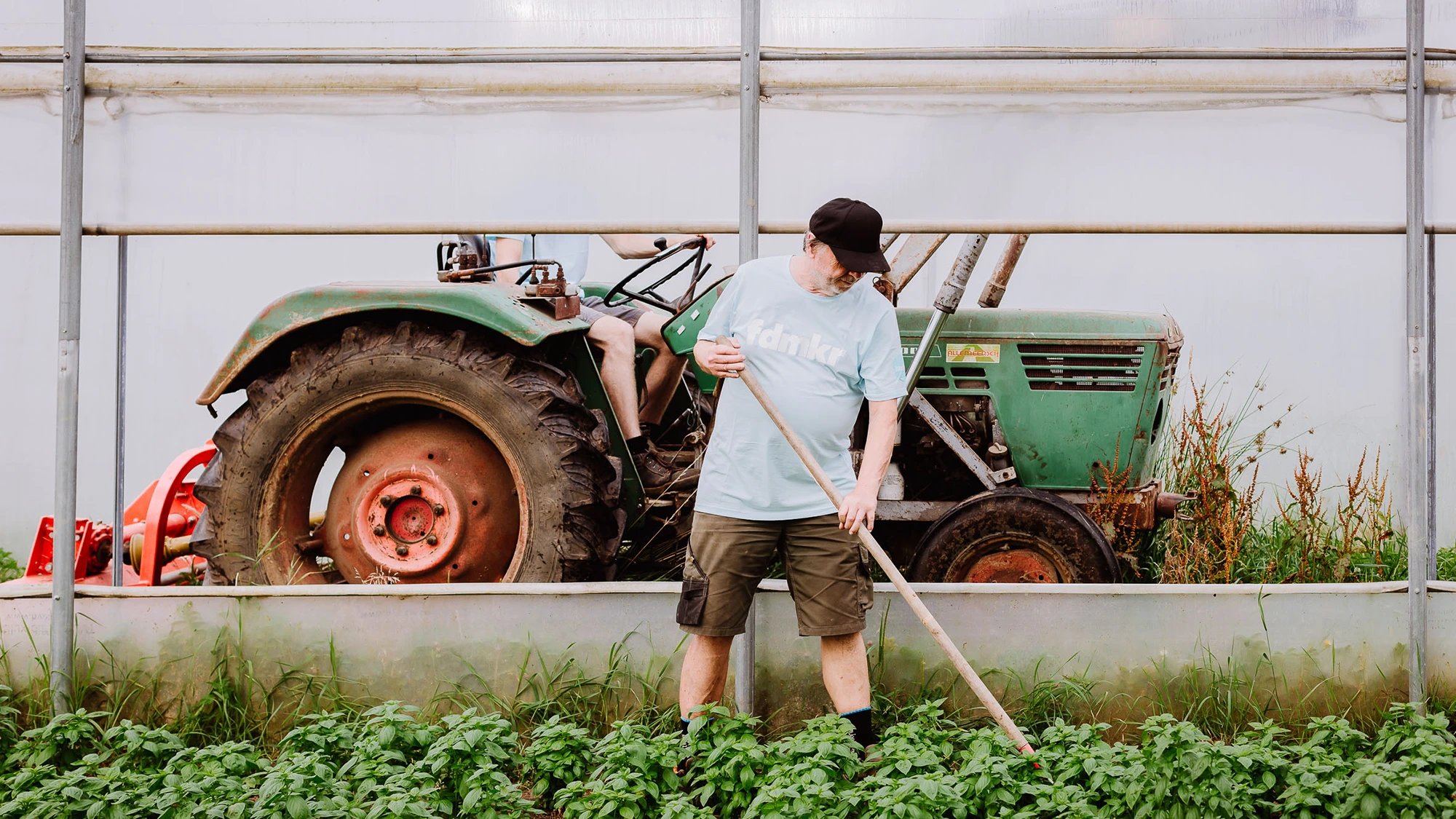 Farmer tending to crops.